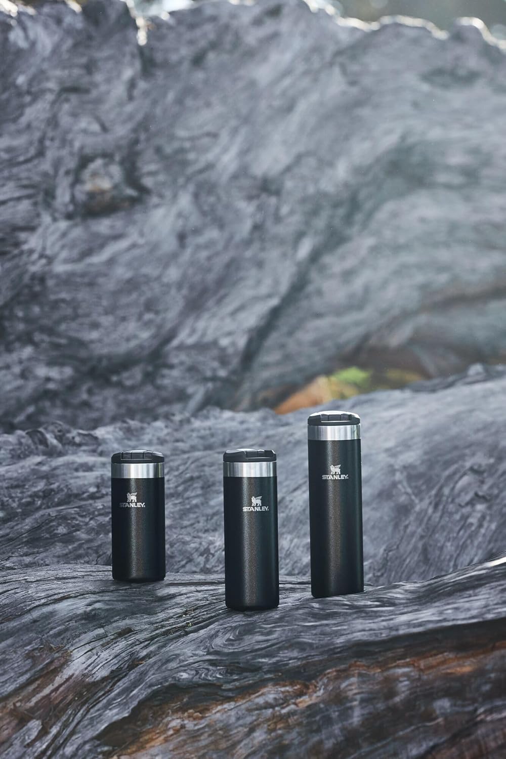 Stanley AeroLight Transit Bottle 20 oz | Locking Drink Through Lid | Leak Resistant Water Bottle or Coffee Travel Mug | Lightweight Insulated Stainless Steel | BPA-Free | Black Glimmer