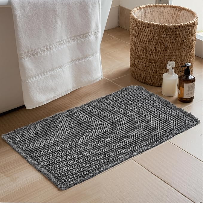 KGORGE Waffle Bath Mat, Super Absorbent 17" X 24" Farmhouse Ultra Soft Bathroom Rugs with Tassels for Bathroom Decor, Boho Non Slip Rubber Backed Shower Mats for Floor Bathtubs, Grey, 1pc